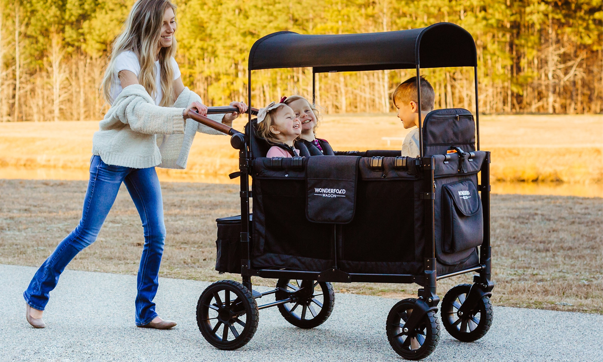 WonderFold stroller wagon for multiple children at an Australian park