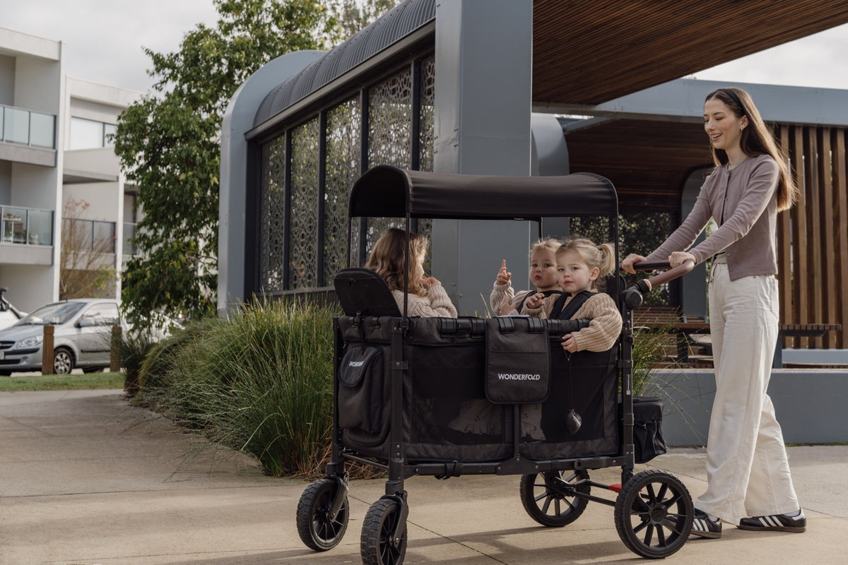 WonderFold wagon with family outdoors